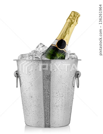 Bottle rests in champagne buckets with ice isolated on white 136261964
