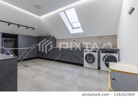 Complete Modern Attic Laundry Room Interior with Drying Rack 136262064
