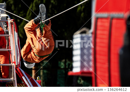 Ranger firefighters walk across a rope during a rescue demonstration at the New Year's rescue ceremony. Ranger firefighters walk across a rope during a rescue demonstration at the New Year's rescue ceremony. 136264612