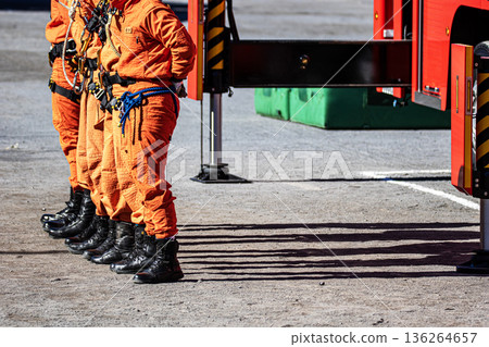 Firefighters line up to demonstrate firefighting training at the New Year's ceremony Firefighters line up to demonstrate firefighting training at the New Year's ceremony 136264657
