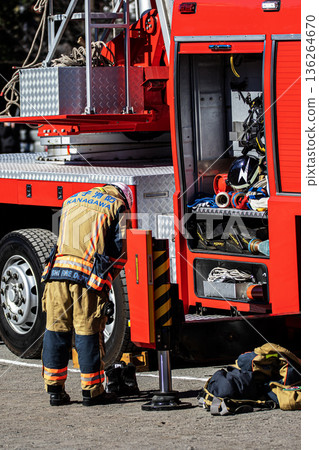 Firefighters prepare next to a fire engine to demonstrate firefighting training at the New Year's ceremony Firefighters prepare next to a fire engine to demonstrate firefighting training at the New Year's ceremony 136264670