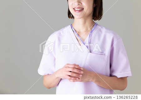 A middle-aged female nurse in a medical scrub A middle-aged female nurse in a medical scrub 136265228