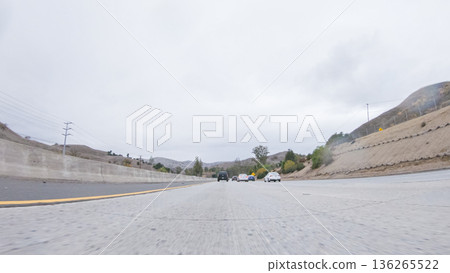 Amidst a rainy winter day, driving on HWY 134 near Los Angeles, California, captures the atmosphere through raindrop-covered lenses, adding a unique and moody perspective to the journey. Amidst a rainy winter day, driving on HWY 134 near Los Angeles, California, captures the atmosphere through raindrop-covered lenses, adding a unique and moody perspective to the journey. 136265522