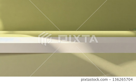 A simple horizontal shelf casts long soft shadows against a muted green wall. The composition highlights light, space, and minimal form. 136265704