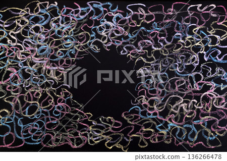 Colorful curly lines with black hole drawn with chalk on scholl blackboard 136266478