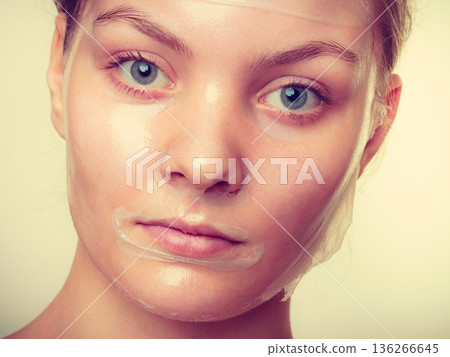Close up woman in facial peel off mask. 136266645