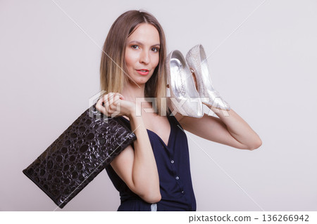 Fashion woman with leather handbag and high heels. 136266942