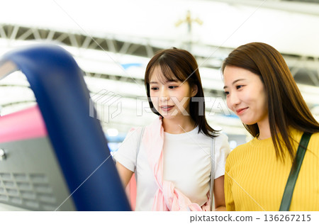 Operating a ticket machine at the station ■Filming cooperation: Kansai International Airport (KIX) 136267215