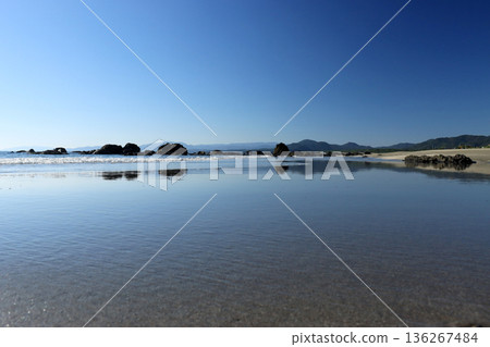 Mirror-like sandy beach 136267484