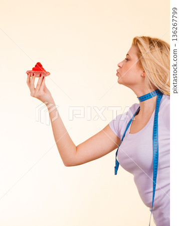 Woman holding strawberry sweet cupcake 136267799