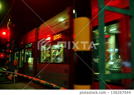 The last train of the Hiroshima Electric Railway glows red in the darkness of the night The last train of the Hiroshima Electric Railway glows red in the darkness of the night 136267844