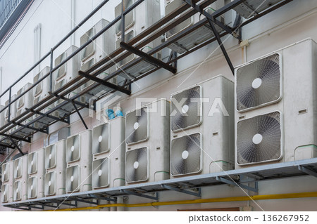 Air conditioner compressor installed in old building. Air conditioner compressor installed in old building. 136267952