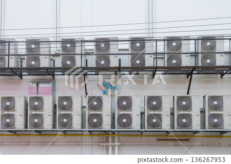 Air conditioner compressor installed in old building.  136267953