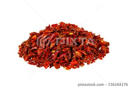 Dried red chili flakes pile on white background Dried red chili flakes pile on white background 136268176