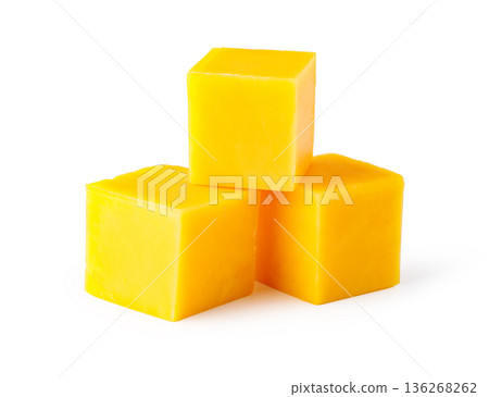 Yellow cheddar cheese cubes forming a small stack 136268262