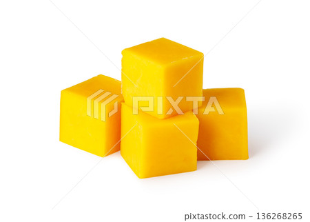 Fresh juicy mango cubes diced on white Fresh juicy mango cubes diced on white 136268265
