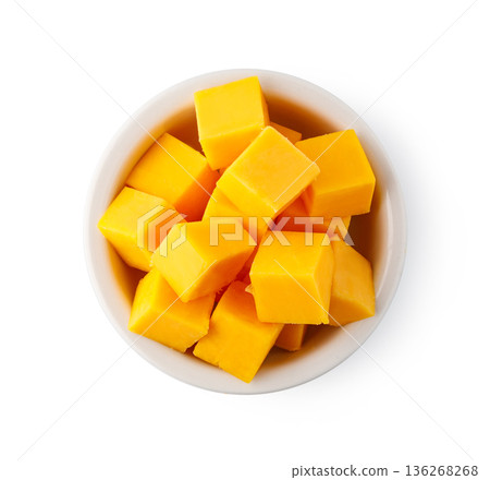 Cheddar cheese cubes in white bowl on background Cheddar cheese cubes in white bowl on background 136268268