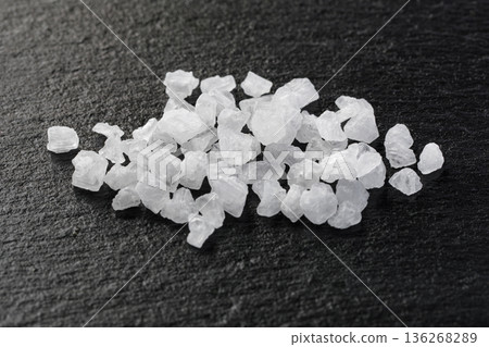 White sea salt crystals displaying coarse natural texture 136268289