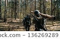 German soldiers marching with Panzerschreck anti-tank weapon in woods German soldiers marching with Panzerschreck anti-tank weapon in woods 136269289
