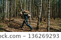 German soldier running through birch forest with motion blur effect German soldier running through birch forest with motion blur effect 136269293