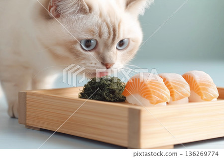 Siberian cat curiously inspects sushi with salmon at a wooden table in a dining setting Siberian cat curiously inspects sushi with salmon at a wooden table in a dining setting 136269774