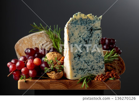 Gorgonzola cheese with ciabatta, walnuts, grapes, and aromatic herbs. 136270126