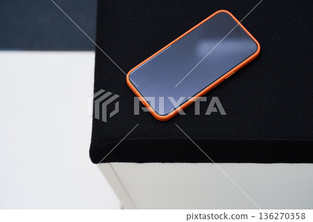 Smartphone on Black Surface - Modern Technology Shot Smartphone on Black Surface - Modern Technology Shot 136270358