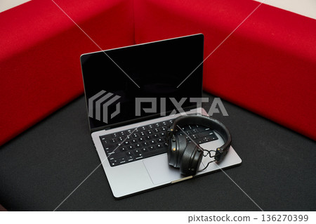 Modern Laptop with Headphones for Productivity 136270399