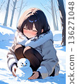 A girl making a snowman 136271048