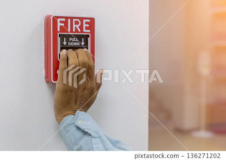 Activate fire alarm trigger system which is installed on granite wall of the building. Activate fire alarm trigger system which is installed on granite wall of the building. 136271202