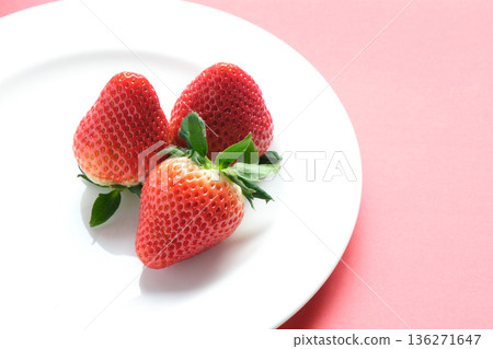 Strawberries on a white plate Strawberries on a white plate 136271647