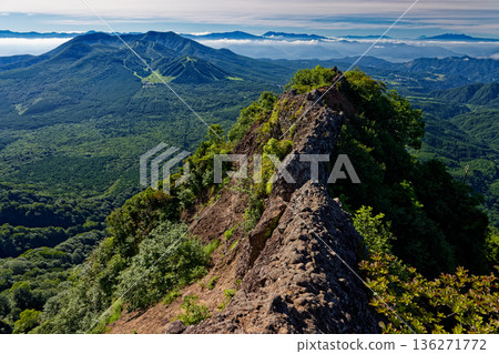 The rocky peaks of Mt. Togakushi's Ant Tower Crossing and the mountain ranges of Mt. Iizuna, Mt. Asama, Mt. Fuji, Mt. Yatsugatake, and the Southern Alps The rocky peaks of Mt. Togakushi's Ant Tower Crossing and the mountain ranges of Mt. Iizuna, Mt. Asama, Mt. Fuji, Mt. Yatsugatake, and the Southern Alps 136271772
