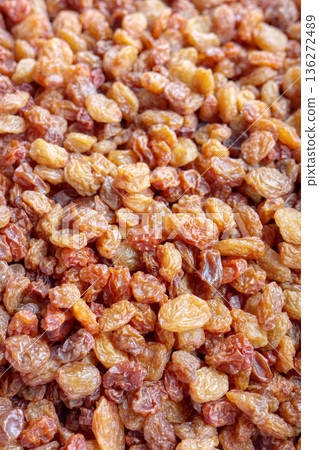 Close up photo of sultana raisins, selective focus. 136272489