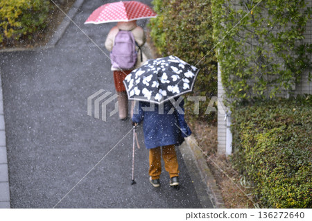 Yokohama cityscape in Japan. Freezing cold with powdery snow falling... steps and uneven terrain... aging society. Elderly woman with a walking stick = Yokohama city Yokohama cityscape in Japan. Freezing cold with powdery snow falling... steps and uneven terrain... aging society. Elderly woman with a walking stick = Yokohama city 136272640