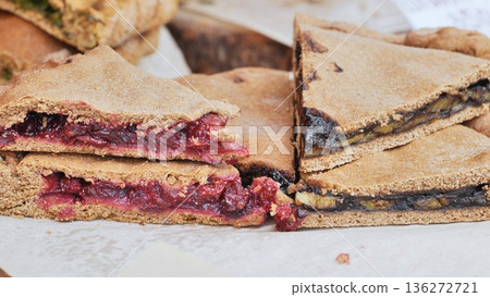 Indian pie slices with sweet fruit filling, berry and banana flavors Indian pie slices with sweet fruit filling, berry and banana flavors 136272721
