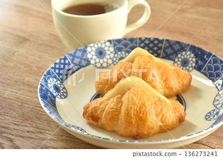 baking crispy butter croissant French bread stuffed ham cheese on plate eat with black hot coffee cup baking crispy butter croissant French bread stuffed ham cheese on plate eat with black hot coffee cup 136273241