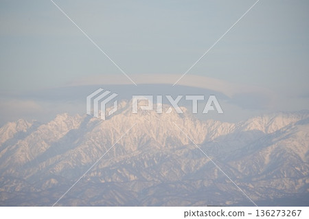 Snow-covered Tateyama mountain range and cap clouds Snow-covered Tateyama mountain range and cap clouds 136273267