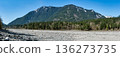View at snowy mountains from stoney mountain riverbed in British Columbia 136273735