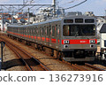 9000 series red stripe running on the Oimachi Line 136273916
