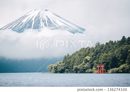 Mount Fuji and a torii gate on Lake Ashi, Japan. Iconic scenery for tourism 136274108