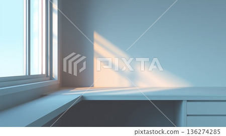 A simple white desk workspace with light streaming in from the window 136274285