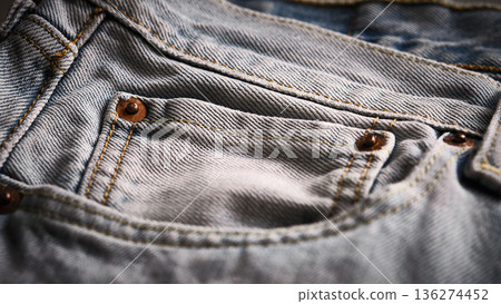 Denim jeans pocket with rivets close-up Denim jeans pocket with rivets close-up 136274452