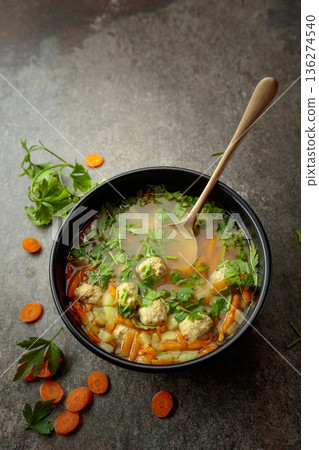 Classic meatball soup with potatoes, carrot and greens. Classic meatball soup with potatoes, carrot and greens. 136274540