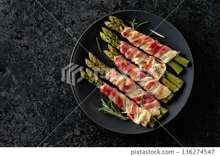 Grilled green asparagus wrapped in bacon. Grilled green asparagus wrapped in bacon. 136274547