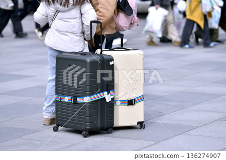 Tokyo cityscape in Japan. Suitcases.... Tokyo Station Marunouchi Square bustling with foreign tourists Tokyo cityscape in Japan. Suitcases.... Tokyo Station Marunouchi Square bustling with foreign tourists 136274907