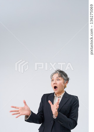 Senior businesswoman with a surprised expression Senior businesswoman with a surprised expression 136275069