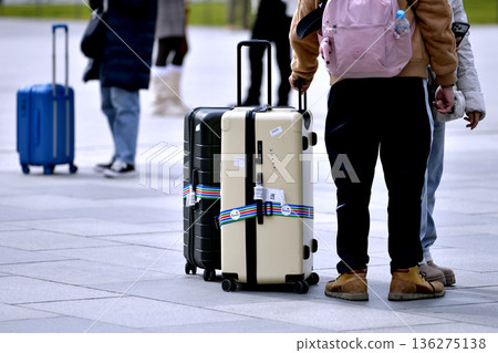 Tokyo cityscape in Japan. Suitcases.... Tokyo Station Marunouchi Square bustling with foreign tourists Tokyo cityscape in Japan. Suitcases.... Tokyo Station Marunouchi Square bustling with foreign tourists 136275138