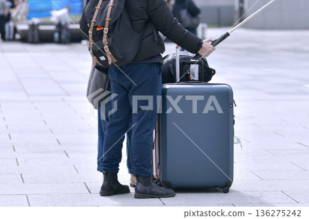 Tokyo cityscape in Japan. Suitcases.... Tokyo Station Marunouchi Square bustling with foreign tourists 136275242