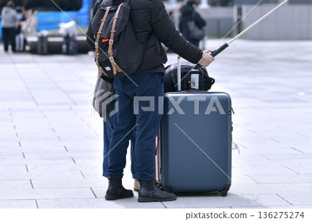 Tokyo cityscape in Japan. Suitcases.... Tokyo Station Marunouchi Square bustling with foreign tourists Tokyo cityscape in Japan. Suitcases.... Tokyo Station Marunouchi Square bustling with foreign tourists 136275274