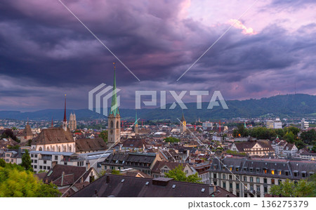 Dramatic Evening Sky over Zurich Old Town Rooftops and Church Towers Dramatic Evening Sky over Zurich Old Town Rooftops and Church Towers 136275379